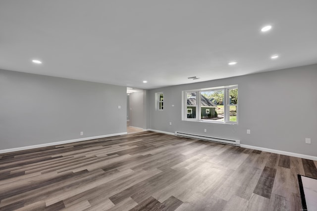 779 New Britain Ave, Rocky Hill, CT 06067 - spare room featuring a baseboard radiator, recessed lighting, wood finished floors, and baseboards