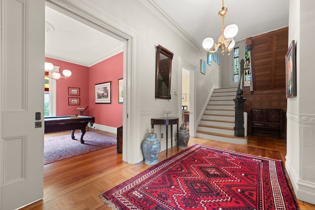 13 Sugar St, Newtown, CT 06470 - entryway with a chandelier, ornamental molding, billiards, stairs, and baseboards