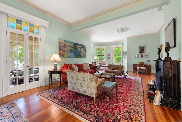 13 Sugar St, Newtown, CT 06470 - living area featuring french doors, ornamental molding, baseboards, and wood finished floors
