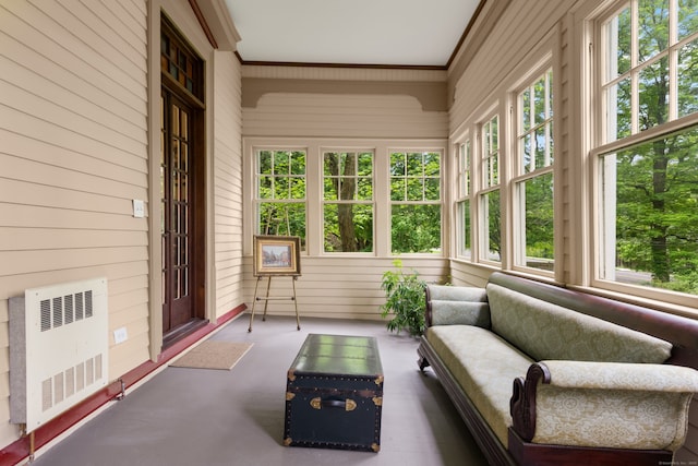 13 Sugar St, Newtown, CT 06470 - sunroom / solarium featuring radiator, wood walls, healthy amount of natural light, and ornamental molding