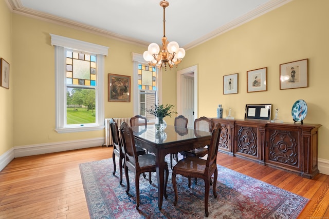 13 Sugar St, Newtown, CT 06470 - dining room with a chandelier, ornamental molding, light wood-type flooring, and baseboards