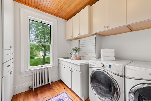 13 Sugar St, Newtown, CT 06470 - washroom with radiator, washer and clothes dryer, cabinet space, wood ceiling, and light wood-type flooring