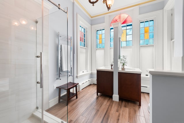 13 Sugar St, Newtown, CT 06470 - full bath with a shower stall, vanity, wood finished floors, plenty of natural light, and ornamental molding