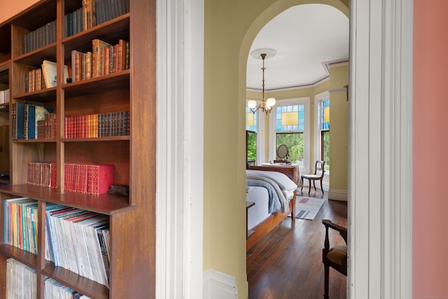 13 Sugar St, Newtown, CT 06470 - hall featuring arched walkways, dark wood-style flooring, baseboards, and a chandelier