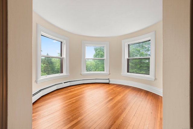 13 Sugar St, Newtown, CT 06470 - empty room featuring light wood-style flooring and baseboard heating