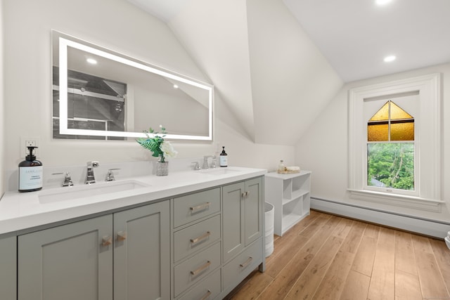 13 Sugar St, Newtown, CT 06470 - full bathroom featuring lofted ceiling, double vanity, hardwood / wood-style floors, baseboard heating, and recessed lighting