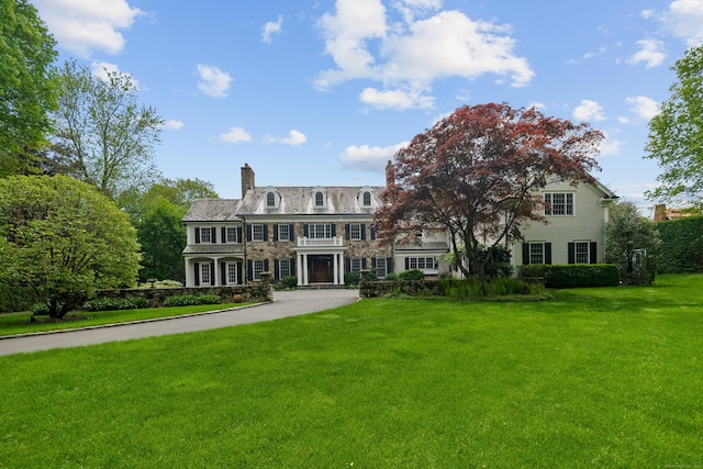 68 Woods End Rd, New Canaan, CT 06840 - colonial home featuring a chimney and a front yard