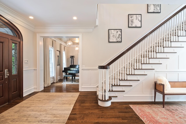 68 Woods End Rd, New Canaan, CT 06840 - foyer entrance featuring crown molding, wood finished floors, a decorative wall, stairway, and a wainscoted wall