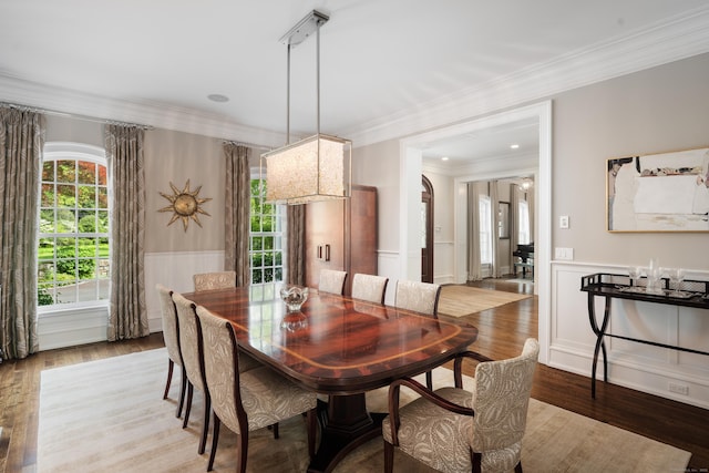 68 Woods End Rd, New Canaan, CT 06840 - dining room featuring a wainscoted wall, wood finished floors, ornamental molding, and a decorative wall