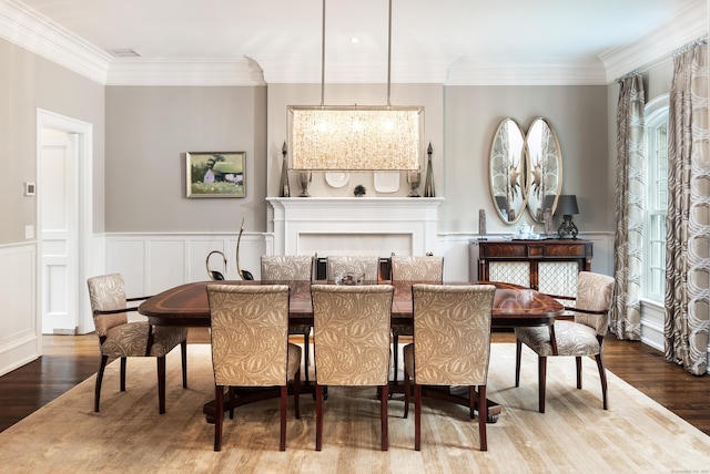 68 Woods End Rd, New Canaan, CT 06840 - dining area with wood finished floors, a decorative wall, crown molding, and wainscoting