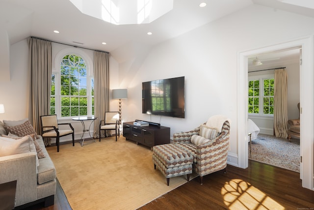 68 Woods End Rd, New Canaan, CT 06840 - living area with vaulted ceiling, wood finished floors, recessed lighting, a skylight, and baseboards