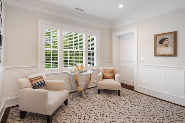 68 Woods End Rd, New Canaan, CT 06840 - living area with plenty of natural light, a decorative wall, crown molding, a wainscoted wall, and wood finished floors