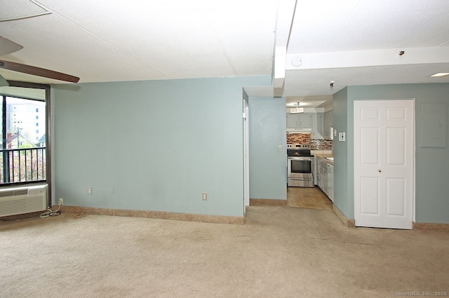 140 Captain Thomas Blvd Unit 307, West Haven, CT 06516 - unfurnished living room featuring baseboards, light colored carpet, and an AC wall unit