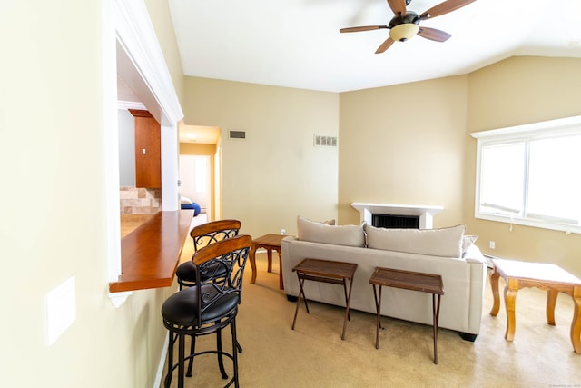 11 Byrne Ct Unit C2, Farmington, CT 06032 - living area featuring ceiling fan, lofted ceiling, a fireplace, and light carpet