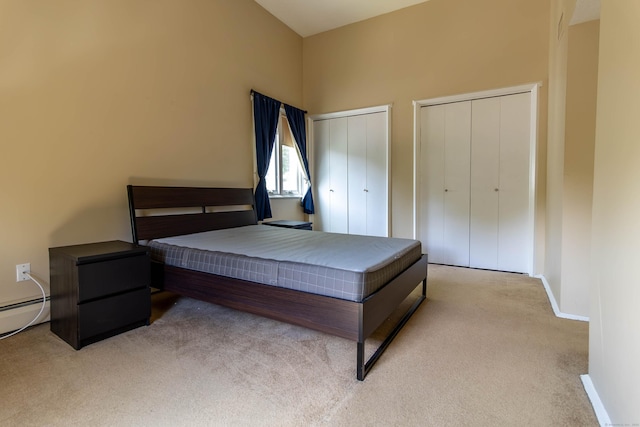 11 Byrne Ct Unit C2, Farmington, CT 06032 - bedroom featuring light carpet, multiple closets, baseboards, and baseboard heating