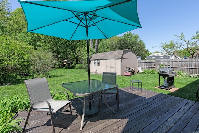 21 Bethpage Dr, Bethel, CT 06801 - wooden terrace with an outbuilding, outdoor dining space, a grill, and a storage unit