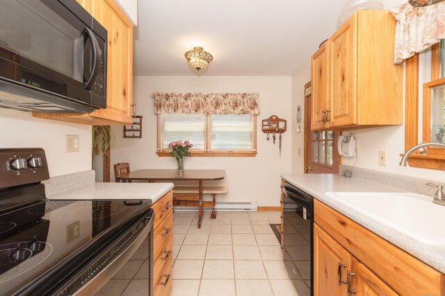 21 Bethpage Dr, Bethel, CT 06801 - kitchen with black appliances, a sink, light countertops, light tile patterned flooring, and baseboards