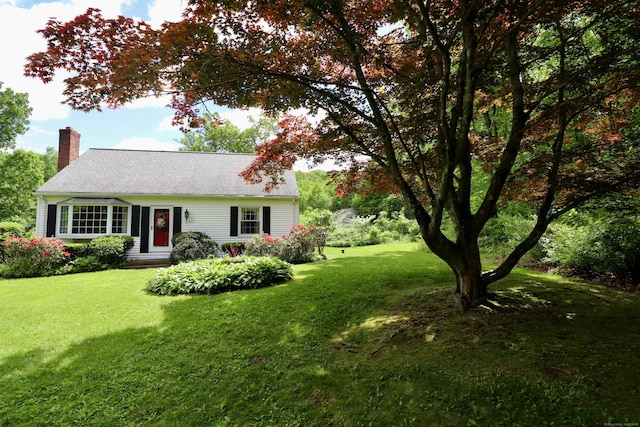 152 Cedar Ln, Middletown, CT 06457 - view of front of home featuring a chimney and a front lawn
