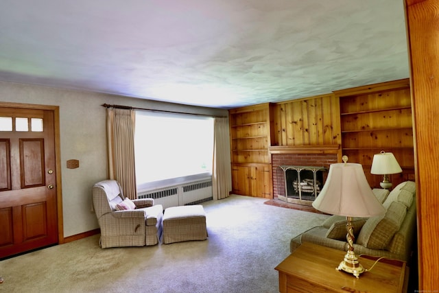 152 Cedar Ln, Middletown, CT 06457 - living room with radiator, a fireplace, and carpet flooring