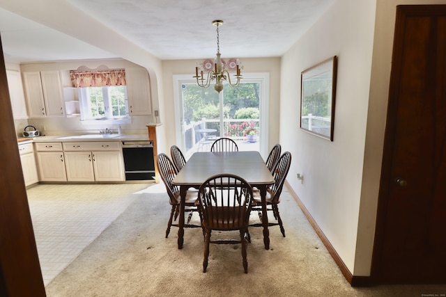 152 Cedar Ln, Middletown, CT 06457 - dining area featuring a chandelier, baseboards, and light carpet