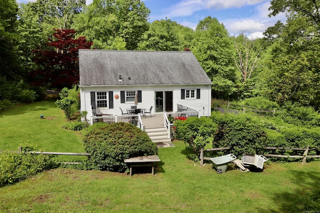 152 Cedar Ln, Middletown, CT 06457 - back of property with a wooden deck, a yard, a chimney, and a shingled roof