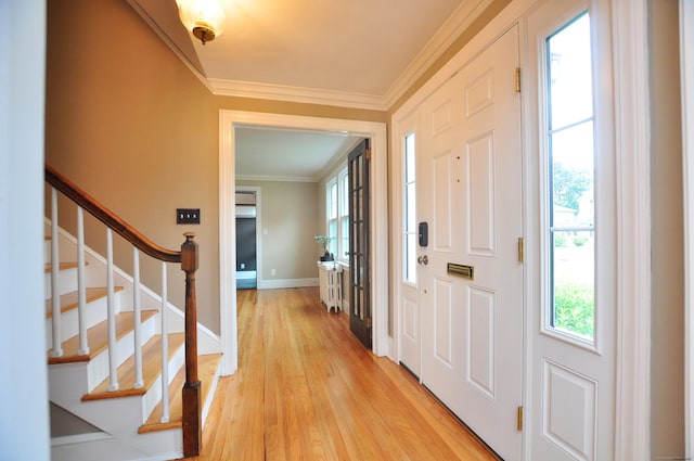16 Ridgewood Rd, Windsor, CT 06095 - foyer entrance with crown molding, light wood finished floors, and stairway