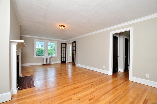 16 Ridgewood Rd, Windsor, CT 06095 - unfurnished living room with radiator heating unit, light wood-style flooring, crown molding, and a fireplace