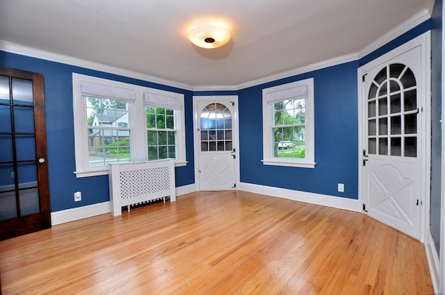 16 Ridgewood Rd, Windsor, CT 06095 - unfurnished room featuring ornamental molding, light wood finished floors, radiator heating unit, and built in shelves