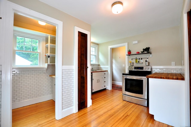 16 Ridgewood Rd, Windsor, CT 06095 - kitchen with electric range, butcher block counters, light wood finished floors, and open shelves
