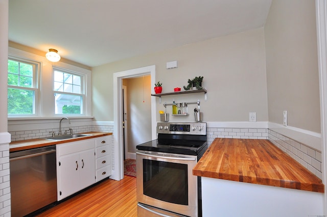16 Ridgewood Rd, Windsor, CT 06095 - kitchen featuring appliances with stainless steel finishes, wooden counters, white cabinets, open shelves, and decorative backsplash