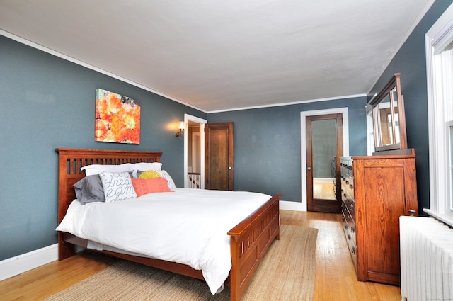16 Ridgewood Rd, Windsor, CT 06095 - bedroom featuring radiator, light wood-type flooring, and crown molding