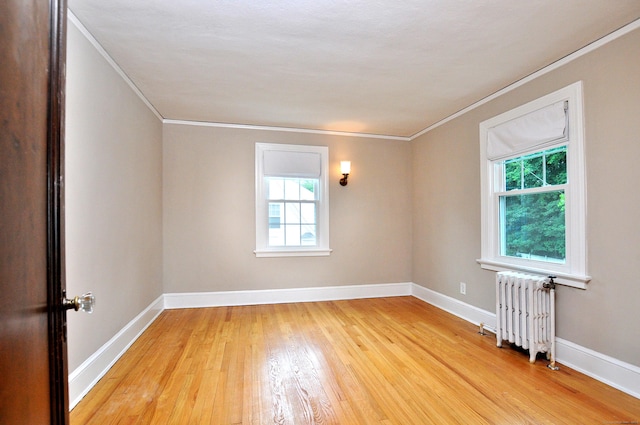 16 Ridgewood Rd, Windsor, CT 06095 - spare room with radiator heating unit, crown molding, plenty of natural light, and light wood-style flooring