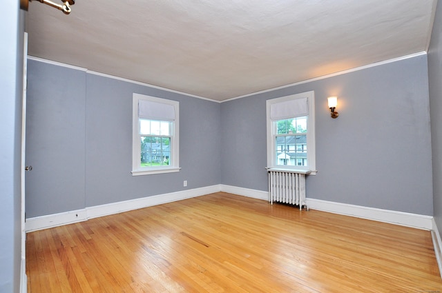 16 Ridgewood Rd, Windsor, CT 06095 - spare room with radiator heating unit, plenty of natural light, crown molding, and light wood finished floors