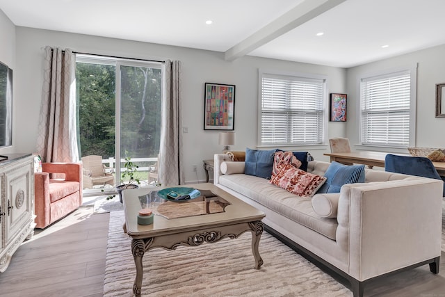 living room featuring plenty of natural light, wood finished floors, beamed ceiling, and recessed lighting