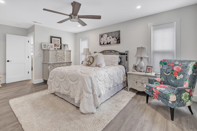 bedroom with wood finished floors, recessed lighting, and ceiling fan