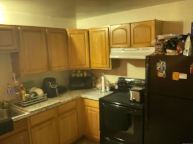 45 Ludlow St, Waterbury, CT 06710 - kitchen featuring black appliances, exhaust hood, and light countertops