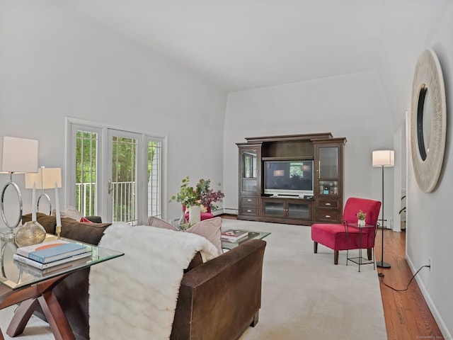 20 Mountain Wood Rd, Stamford, CT 06903 - living area with a baseboard heating unit, wood finished floors, and baseboards