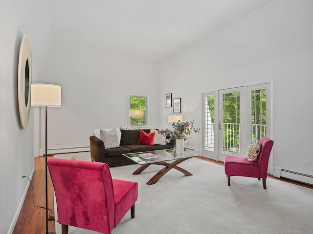20 Mountain Wood Rd, Stamford, CT 06903 - living room featuring a baseboard heating unit, baseboards, and wood finished floors