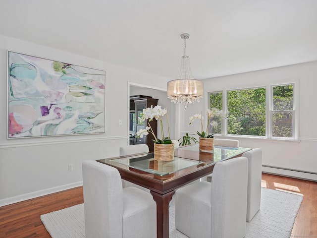 20 Mountain Wood Rd, Stamford, CT 06903 - dining area with a chandelier, wood finished floors, a baseboard heating unit, and baseboards