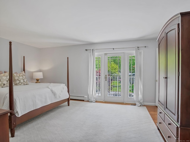 20 Mountain Wood Rd, Stamford, CT 06903 - bedroom with baseboard heating, access to exterior, light wood-style flooring, and baseboards