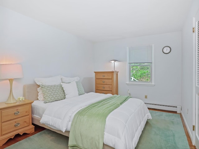 20 Mountain Wood Rd, Stamford, CT 06903 - bedroom featuring a baseboard radiator, baseboards, and wood finished floors