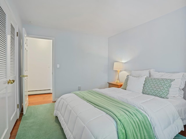 20 Mountain Wood Rd, Stamford, CT 06903 - bedroom with baseboard heating and wood finished floors
