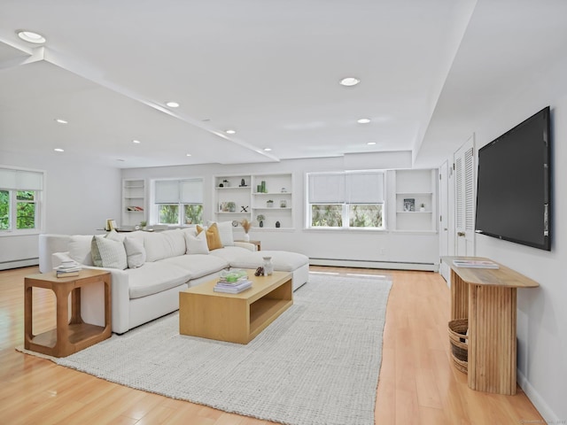 20 Mountain Wood Rd, Stamford, CT 06903 - living area with a baseboard radiator, light wood-style floors, and a baseboard heating unit