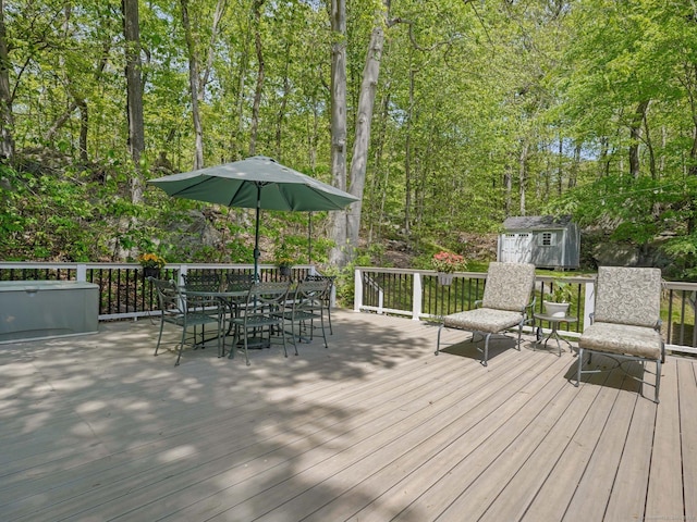 20 Mountain Wood Rd, Stamford, CT 06903 - deck with a shed, outdoor dining area, and an outbuilding