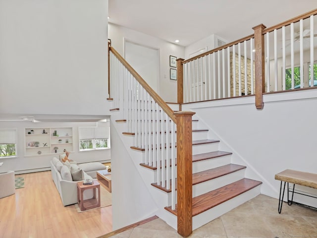 20 Mountain Wood Rd, Stamford, CT 06903 - stairs featuring a high ceiling, a baseboard radiator, and recessed lighting
