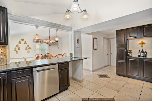 kitchen featuring stainless steel dishwasher, a chandelier, light tile patterned floors, dark brown cabinets, and dark stone counters