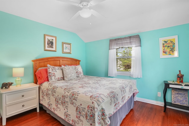 bedroom with lofted ceiling, wood finished floors, baseboards, and a ceiling fan