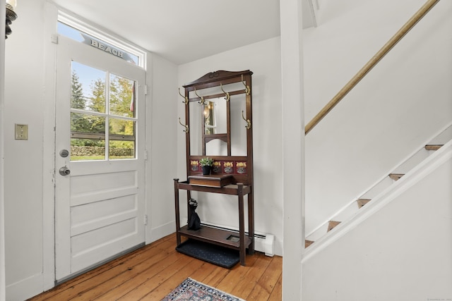 foyer with hardwood / wood-style floors and stairs