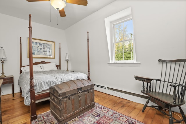 bedroom with hardwood / wood-style floors and ceiling fan