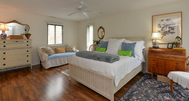 bedroom featuring dark wood-style floors and ceiling fan